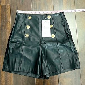 Zara black high waisted faux leather shorts with gold button detail. NWT!